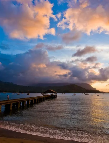 Historic Hanalei Pier at sunset on Kauaʻi in Hawaiʻi