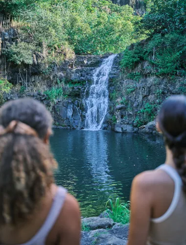 Visitors admiring Waimea Falls on the North Shore of Oʻahu