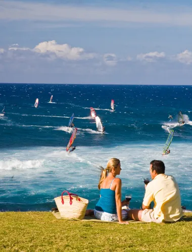 Couple enjoying a picnic overlooking the ocean
