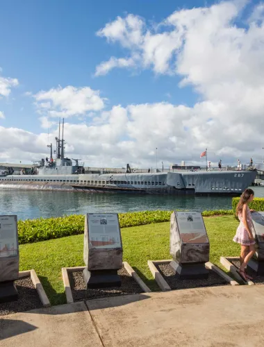 Girl in front of the USS Bowfin at the Pacific Fleet Submarine Museum in Honolulu, Hawaiʻi