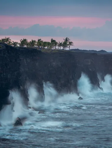 Waves crashing against a cliff side