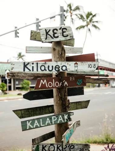 Sign post pointing out directions to neighborhoods in Kauaʻi