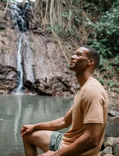 Man at waterfall near Līhuʻe on Kauaʻi 