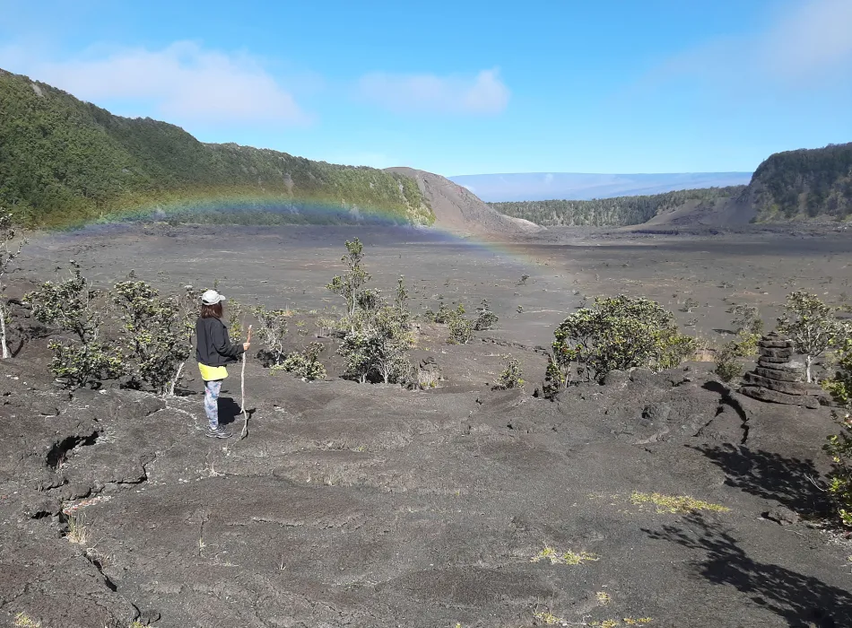 Woman hiking in Hawaiʻi Volcanoes National Park on the island of Hawaiʻi
