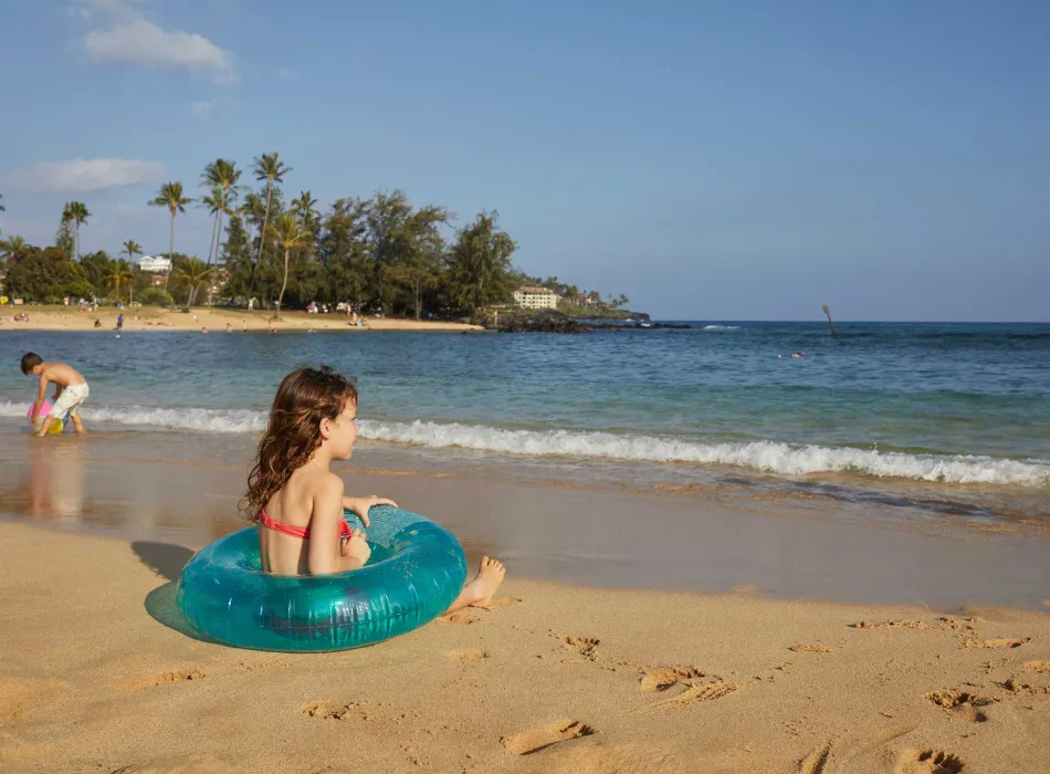 Family fun at Po‘ipū Beach on Kauaʻi in Hawaiʻi