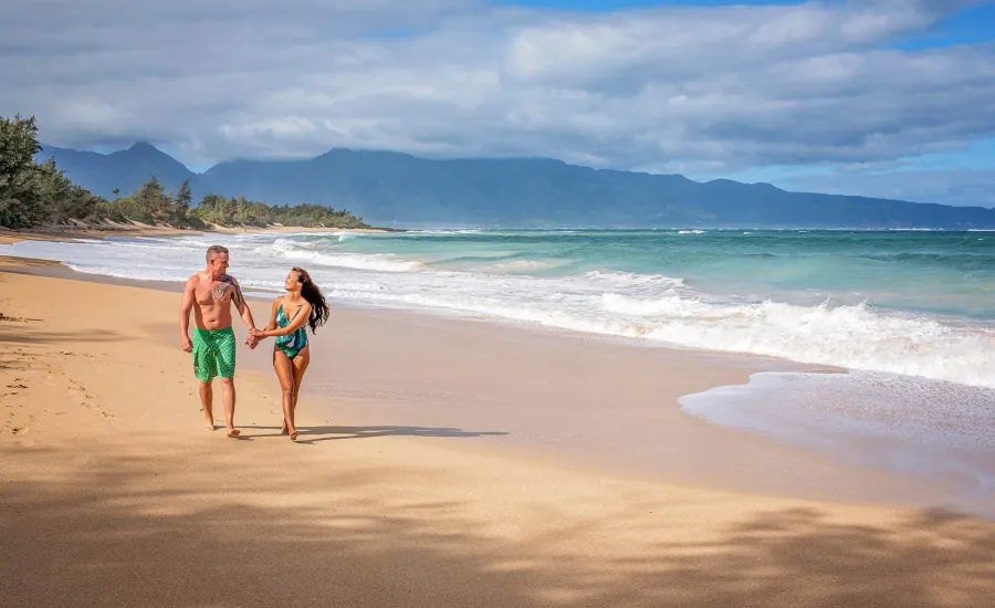  Couple walking on Baldwin Beach Maui